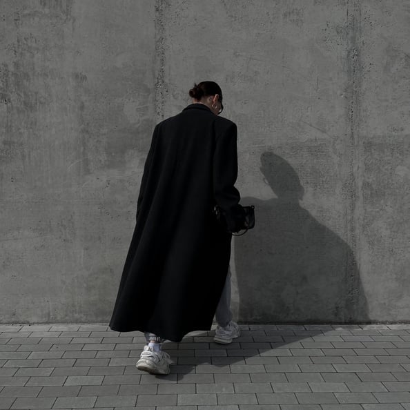 A Woman in Black Coat 